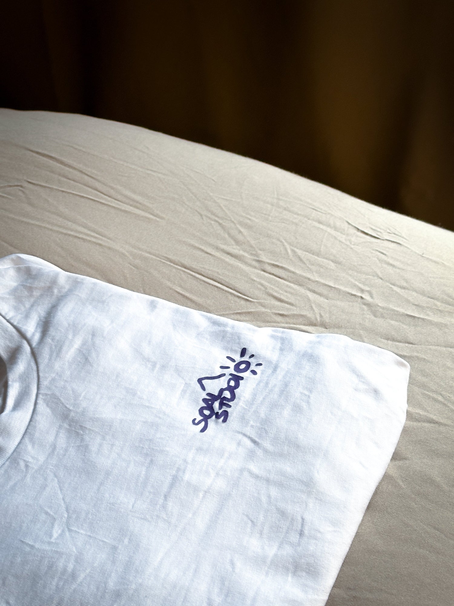 White SOAL Studio with purple Dragon print on beige and brown bedroom sheet